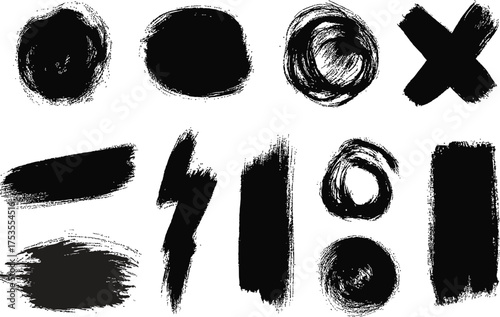 Collection of diverse black ink brush stroke textures and abstract shapes including circles smudges and lines on a white background
