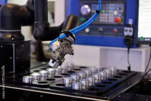 robot manipulator loads workpiece in CNC machine