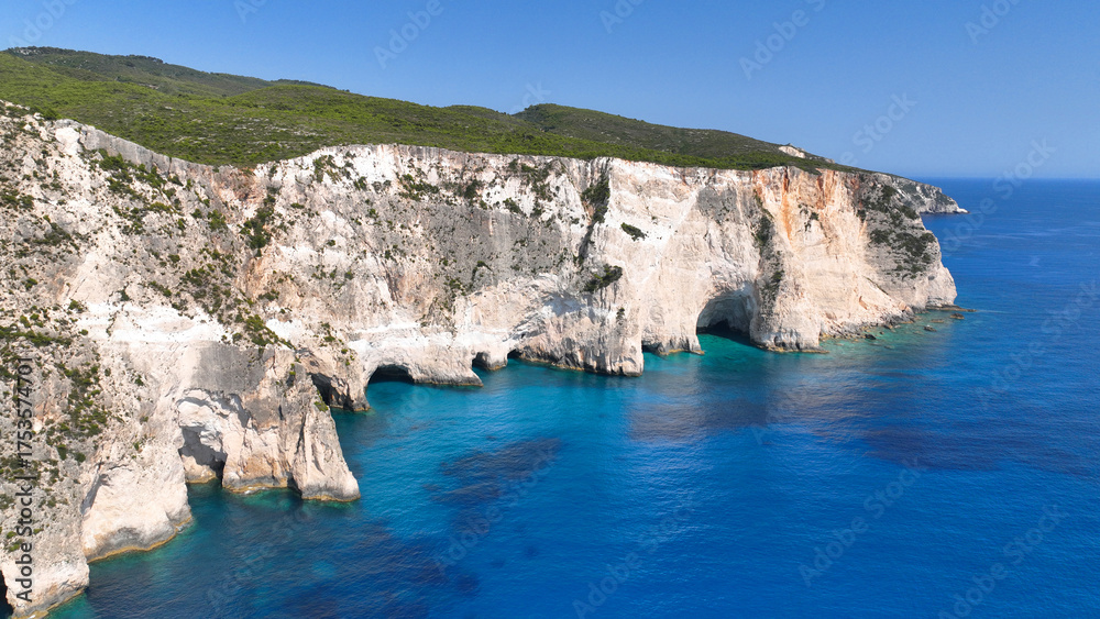 Fototapeta premium Aerial drone photo of tropical Caribbean island paradise bay with white rock caves and turquoise clear sea