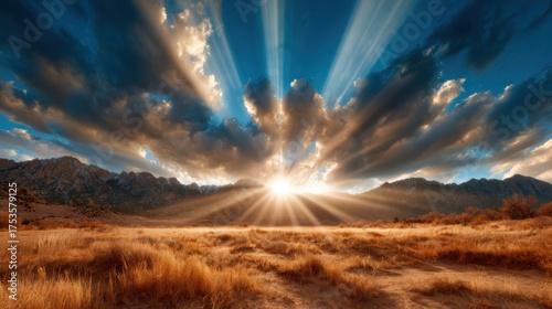 An awe-inspiring sunset casts rays of light through dramatic clouds over a beautiful mountain landscape, creating a breathtaking view that evokes wonder and peace.