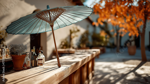 Wallpaper Mural Sunlight filter on a parasol placed on a bar counter in an autumn courtyard Torontodigital.ca