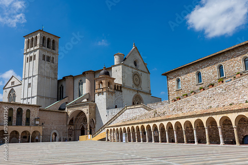 Wallpaper Mural Basilica of St. Francis of Assisi in Umbria, Italy. The stunning architecture of this historical site is highlighted against a bright blue sky on a sunny day. Torontodigital.ca