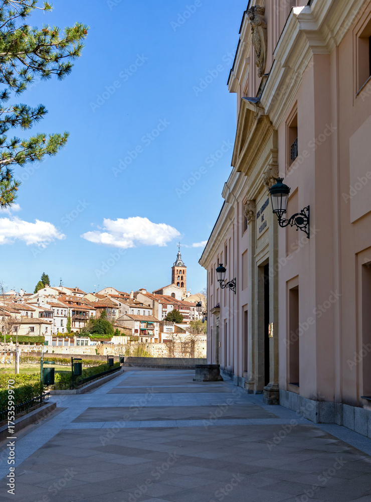 Fototapeta premium A far away view of Segovia's downtown from the front plaza of the Alcazar castle, providing a sweeping panorama of the historic Segovian city skyline and the distant downtown