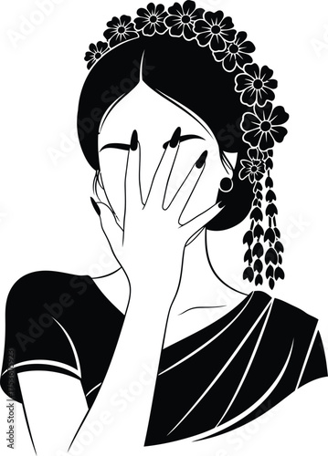 Elegant woman with flower crown and veil covering face with hand in traditional attire