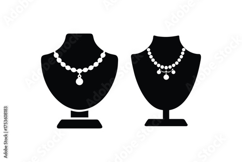 Black necklace display busts with delicate pearl jewelry showcased beautifully