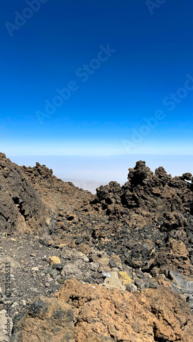Desert, yellow rocks against the blue sky. Scenic ascent to Mount Teide, Tenerife