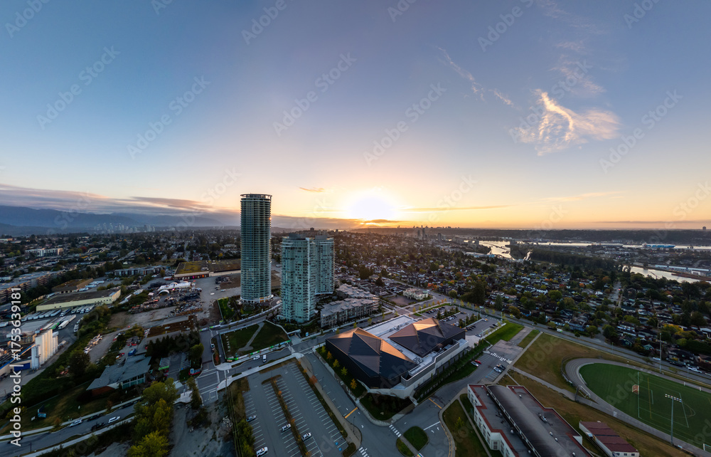 Fototapeta premium Aerial Sunset Over New Westminster Skyline With Tall Buildings, River, And Urban Park
