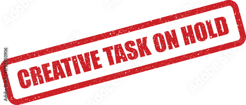 Grungy red rectangular rubber stamp displaying Creative Task On Hold message, signifying a temporary pause