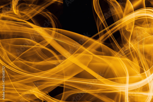 Abstract yellow light trails on black background. Dynamic golden fluid energy waves creating futuristic glowing pattern with flowing motion effect and copy space for creative design concept.