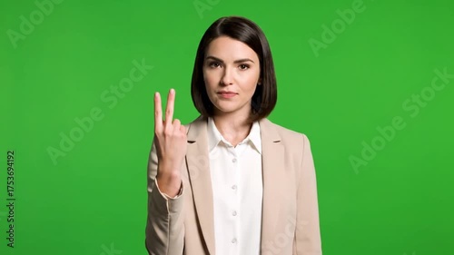 Corporate Woman Counting on Fingers Against Green Screen Background.