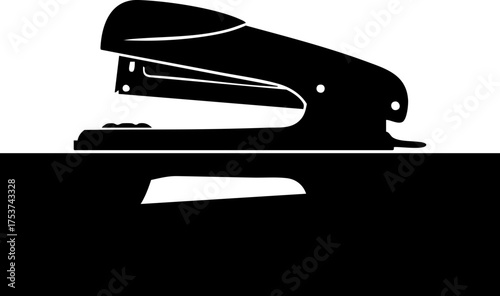 Sleek modern stapler silhouette rests on desk ready for office tasks and document organization, professional tool for business efficiency.