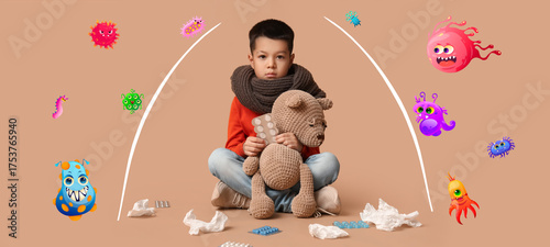 Ill little Asian boy with t...
