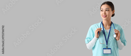 Female Asian doctor with st...