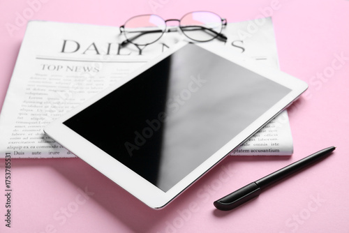 Newspaper with tablet compu...