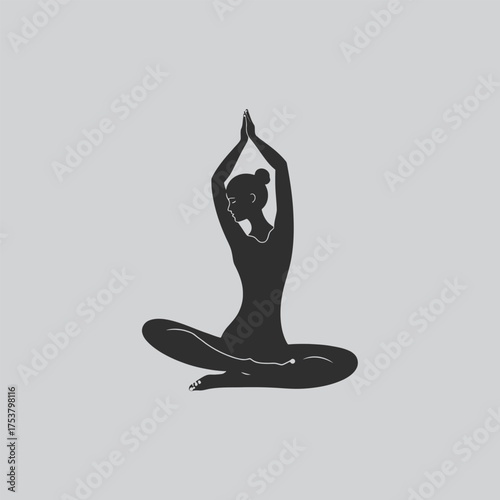 Silhouette of a woman in a meditative yoga pose serene and calm