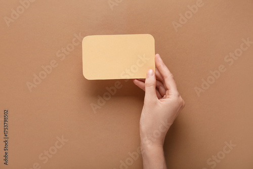 Female hand with blank card...