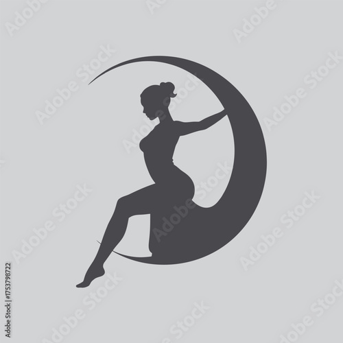 Silhouette of a woman gracefully posed on a crescent moon shape