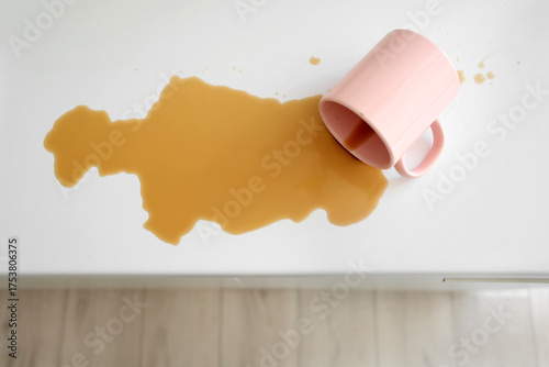 Overturned cup and spilled ...