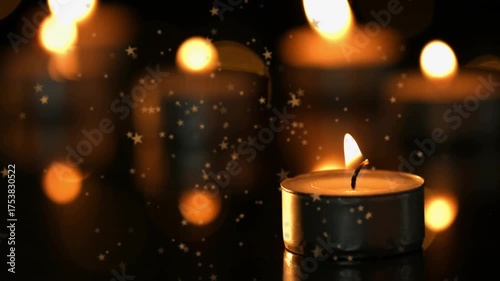 Opening scene showing metal tea light flickering on surface with sparkles drifting, calming mood