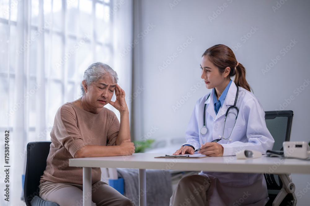 Fototapeta premium Elderly patient consulting doctor about receiving headache treatment