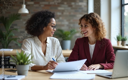 Two businesswoman working on project together. High quality