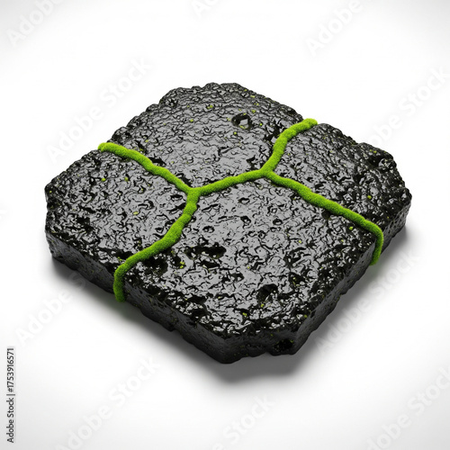 A rough dark textured rock or mineral specimen with a bright green string tied around it in a crisscross pattern isolated on white background