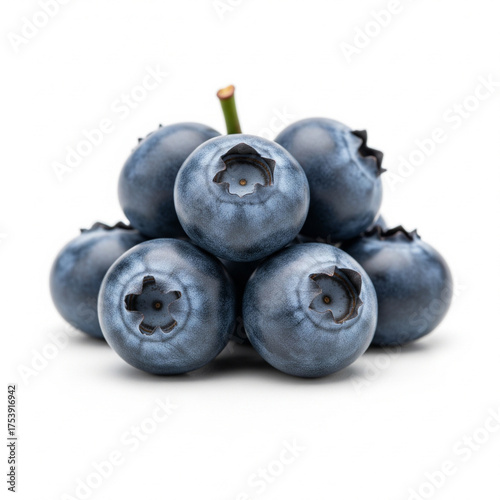 A small pile of fresh ripe juicy blueberries with a stem on a clean white background isolated on white background