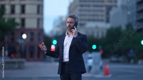Successful businessman outdoor. Businessman use phone. Mature businessman in suit. Corporate business. Rich Hispanic businessman in suit. Phone call conversation. Business call negotiation