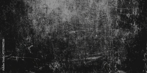 Monochromatic wall texture in black and gray tones with vignette effect.
