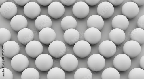 Seamless pattern of white spheres on a gray surface minimalist background with round shapes