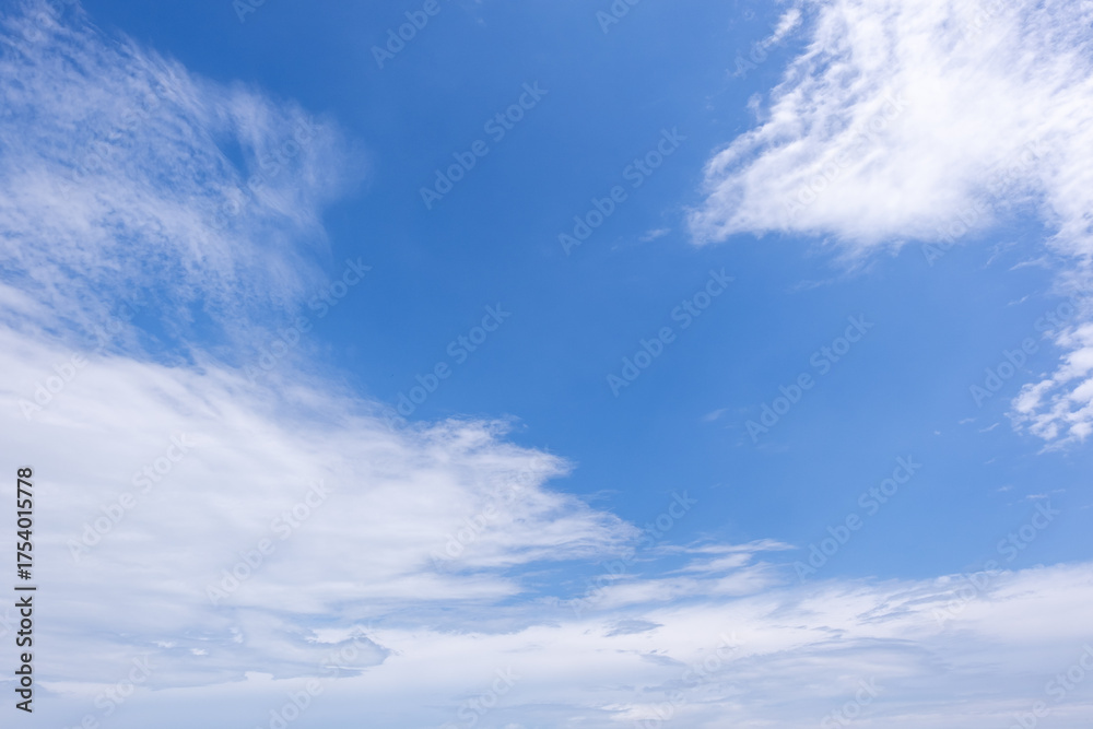 Fototapeta premium clear blue sky background,clouds with background, Blue sky background with tiny clouds. White fluffy clouds in the blue sky. 