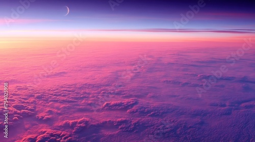 The moon shines against a gradient sky transitioning from deep purple to pink above vast fluffy clouds,