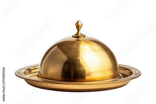 Golden serving cloche raised above empty golden plate on black background dome