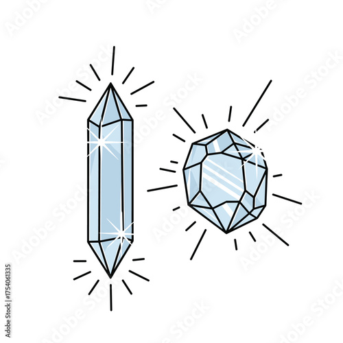 Two sparkling crystals one long and one faceted glowing beautifully.