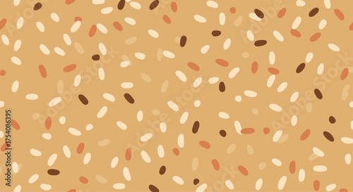 A close up view of tiny brown and white speckles scattered across a tan background.