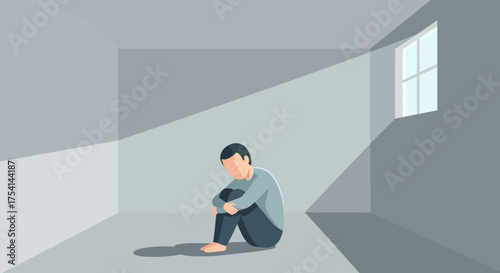 Isolated Man Sitting Alone In A Gray Room By A Window