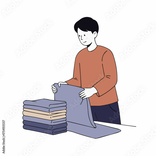 Teen folding clean towels stack