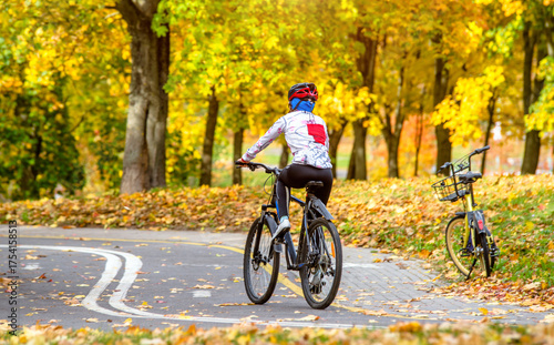 Cyclist ride on the bike path in the city Park
