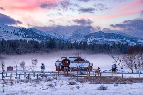 Home and farmland surrounded by beautiful winter landscape in the mountains - Twisp, Methow Valley, Washington