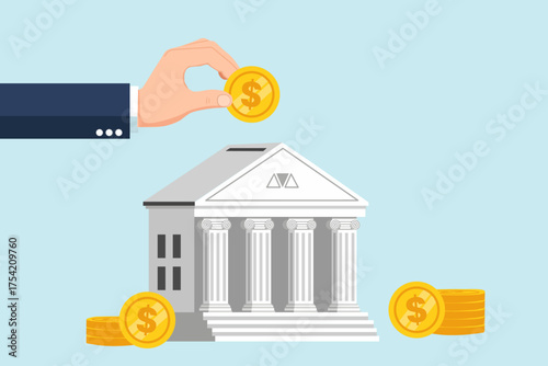 Financial concept of saving money, showing a hand depositing a gold coin into a bank building for future investment and wealth accumulation