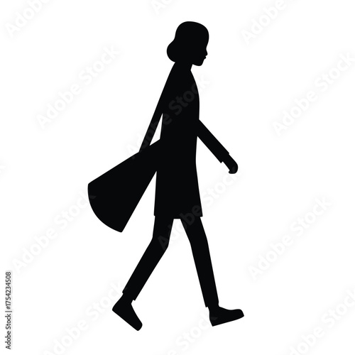 Silhouette of a person walking with a guitar case