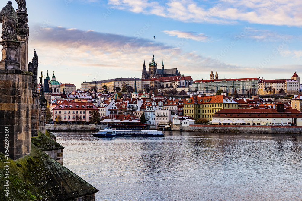 Fototapeta premium Prague, Czech Repoulbic - 11.23.2023: The city, castle and river during a beautiful sunset
