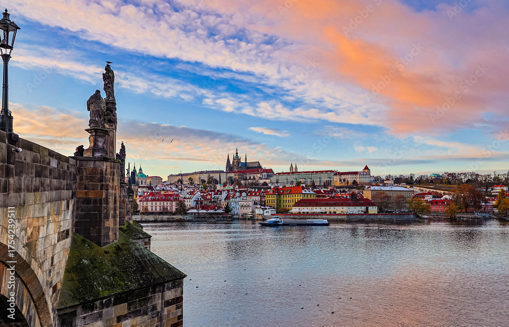 Fototapeta premium Prague, Czech Repoulbic - 11.23.2023: The city, castle and river during a beautiful sunset