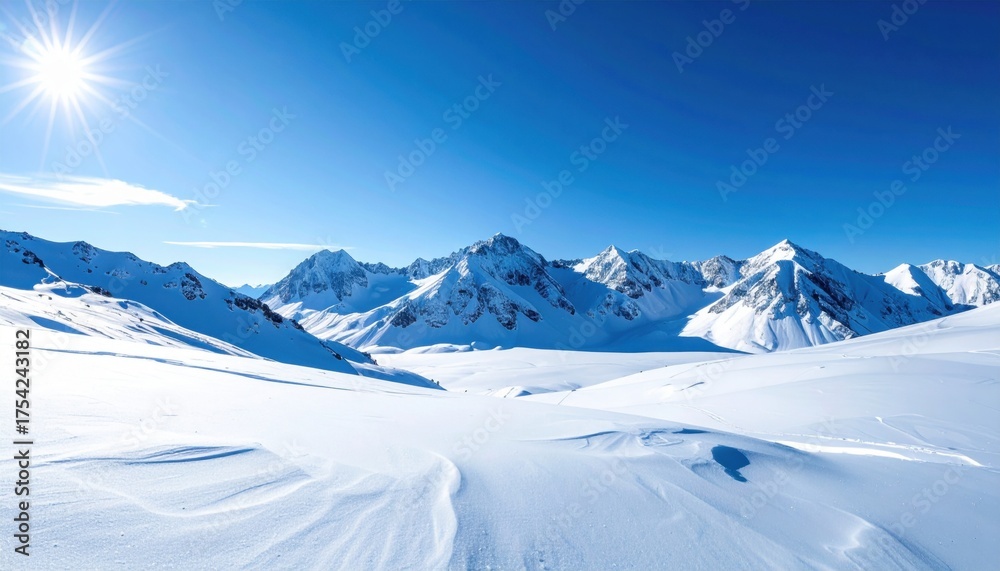 Obraz premium Majestic snow-covered mountains under a bright sun, showcasing a serene winter landscape