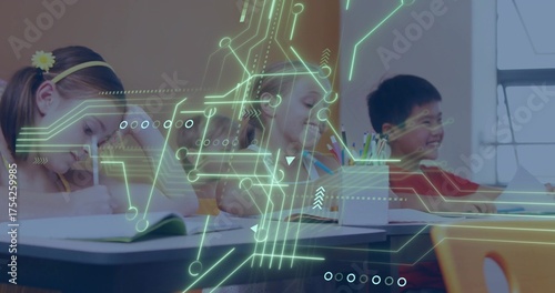 Writing group of children focusing on notebooks at classroom desk, with neon circuit-board overlay