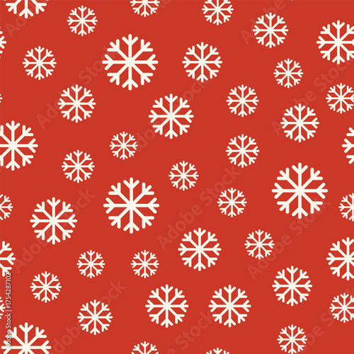 A Christmas minimalist seamless pattern with snowflakes of different sizes on a red background
