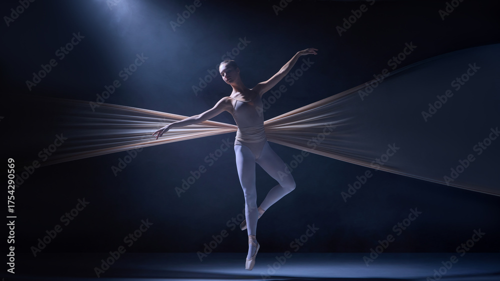 Obraz premium Ballet dancer poised midair entangled in fabric wings illuminated by soft light. Concept of artistic movement, costume flexibility, and physical performance in professional ballet.