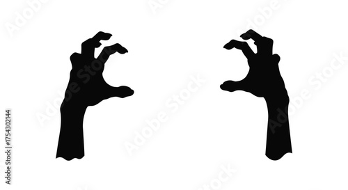 Two spooky black zombie hands reaching out in a creepy silhouette against a white background