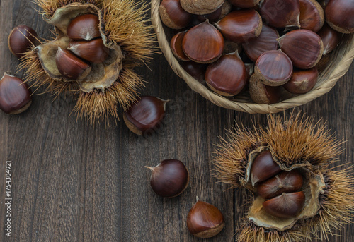 Background with chestnuts on a wooden table