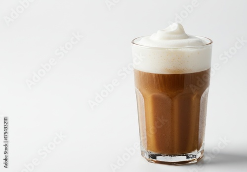 Creamy Coffee Latte with Foamy Top in Clear Glass on White Background